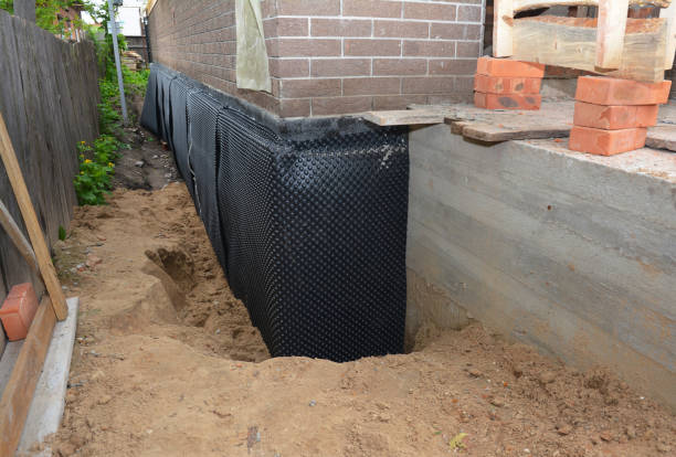 SJ Waterproofing Pros technician performing targeted Waterproofing assessment in Alamo, TN